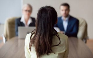 A young woman sitting in an interview