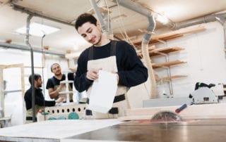 A young man working in a factory