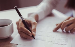 A woman filling out an application