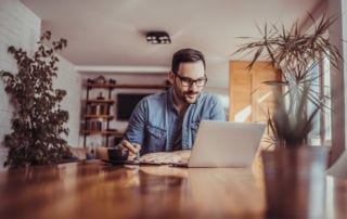 Man with laptop and notebook