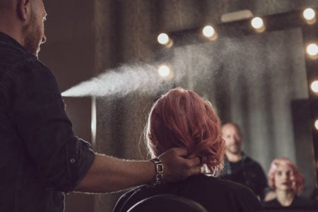 A hair professional styling hair
