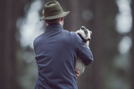 A man carrying a ferret
