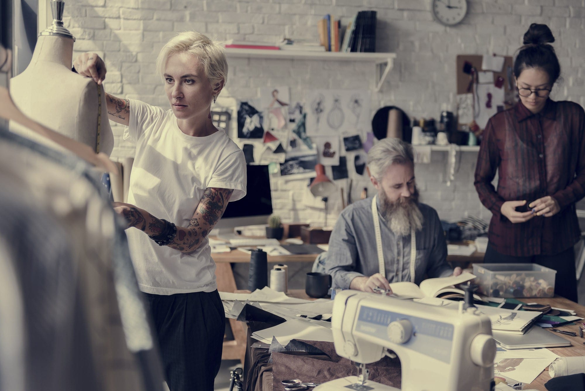 A group of people working in a tailor's shop