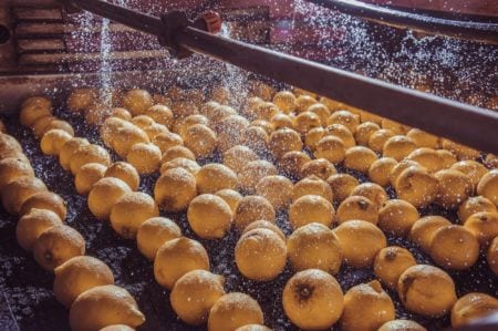 Lemons being washed in a machine