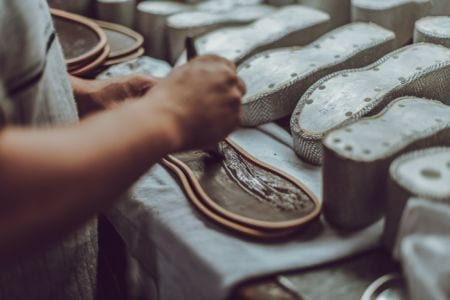 A footwear manufacturer making shoes