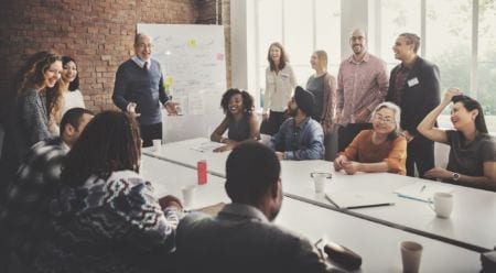 A group of people at a meeting in an office