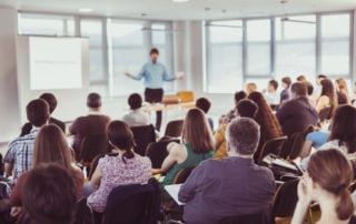 A man lecturing a group of people
