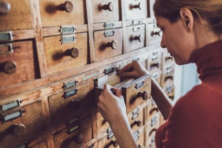Woman opens a database drawer