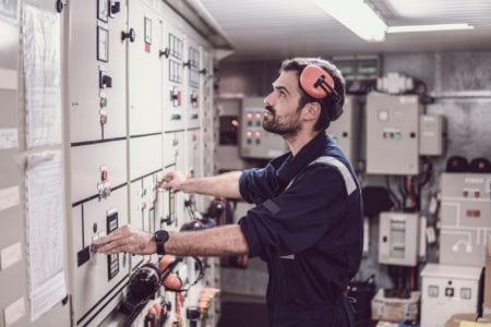 Marine engineer in engine control room