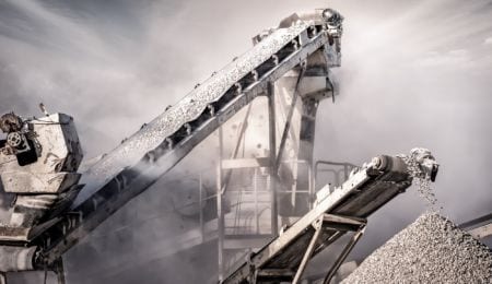 Conveyor belt of heavy machinery loading stones and gravel