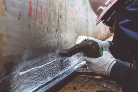 Non-destructive testing engineering technician on duty closeup