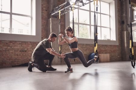 Personal trainer working with his client