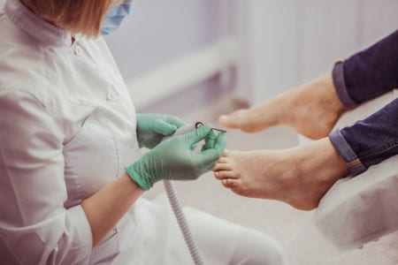 Podiatrist checking a patient's foot