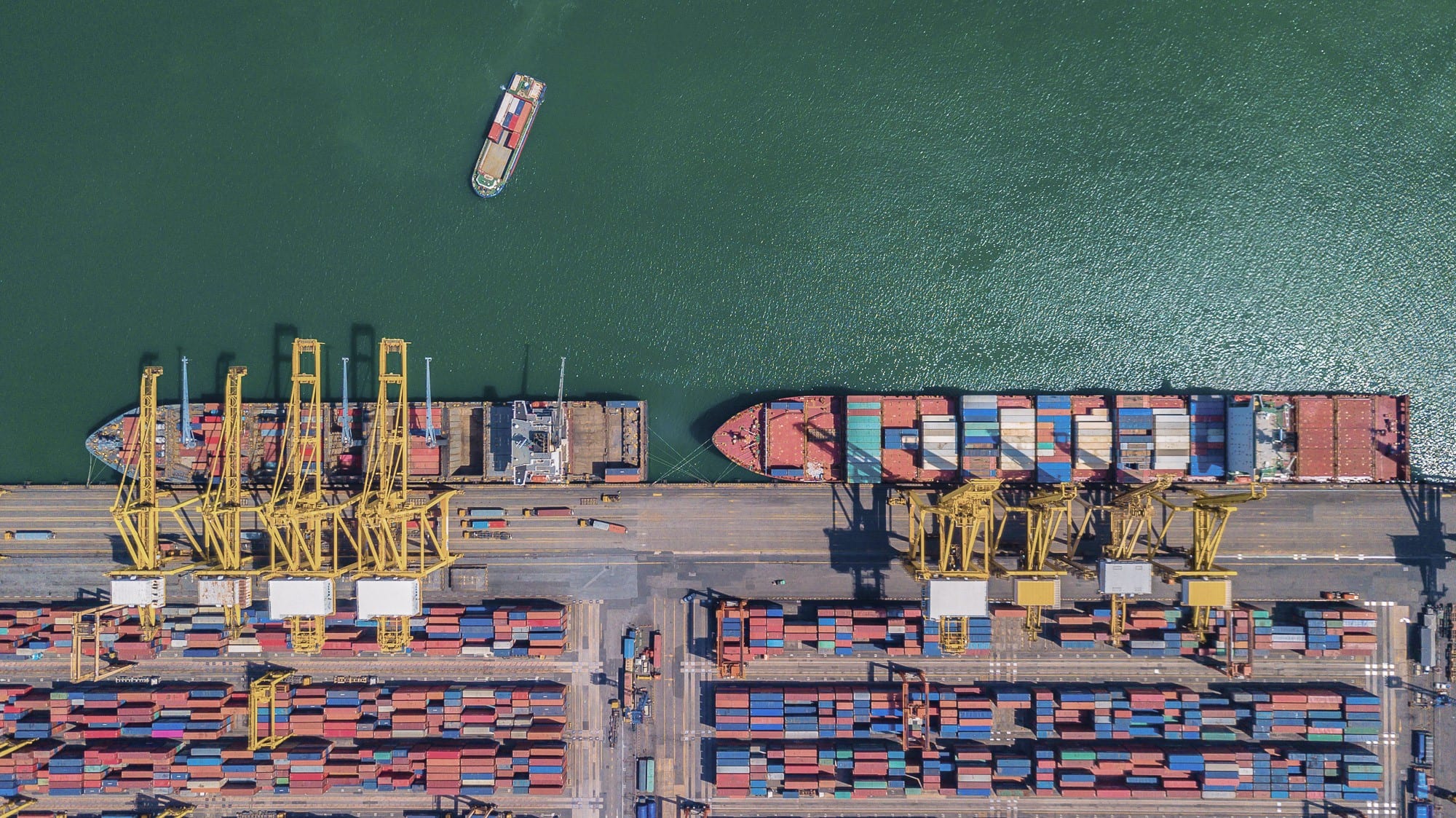 Aerial view over international container cargo ships