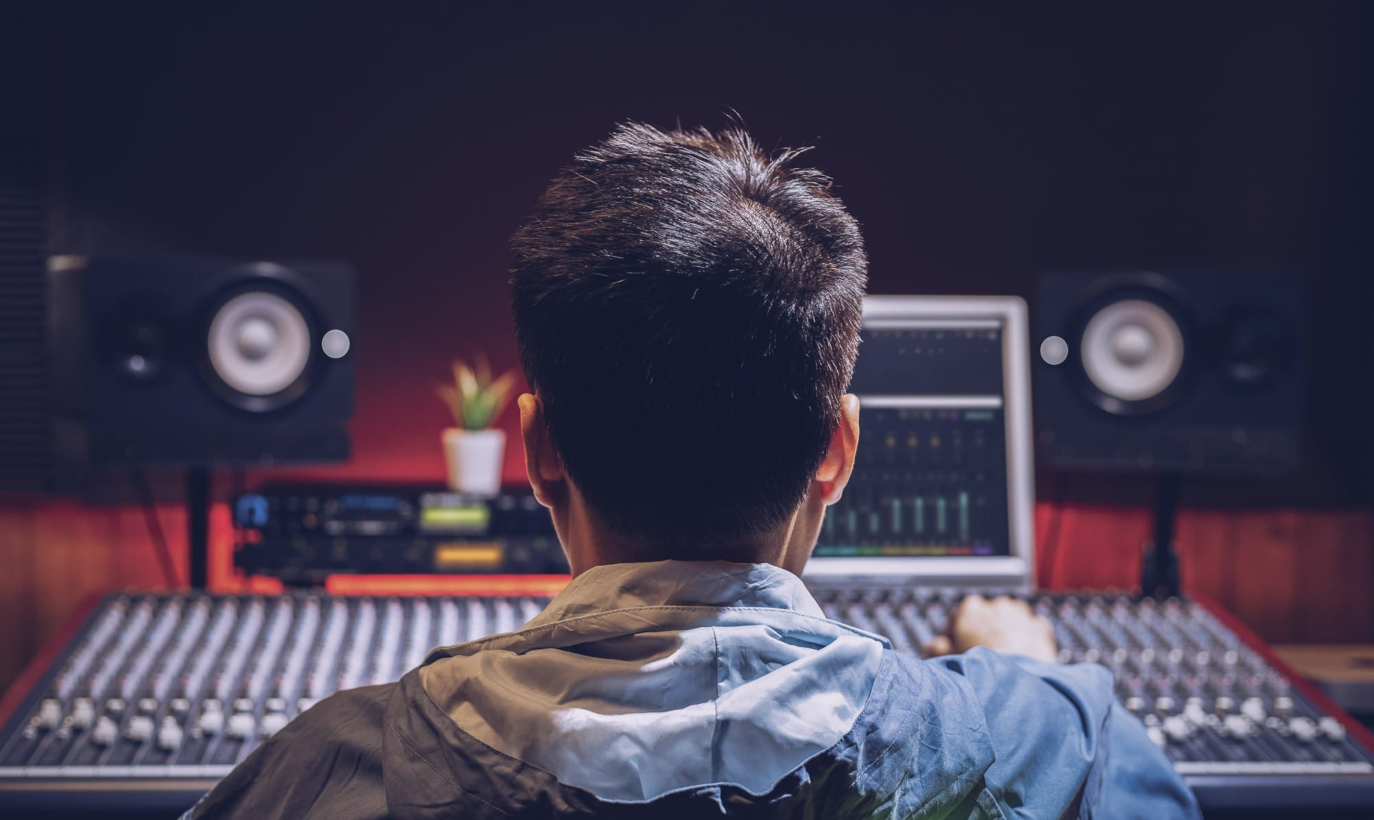 A production technical operator using an audio mixer
