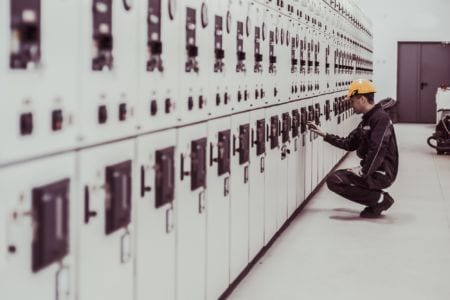 Power engineer testing a control unit