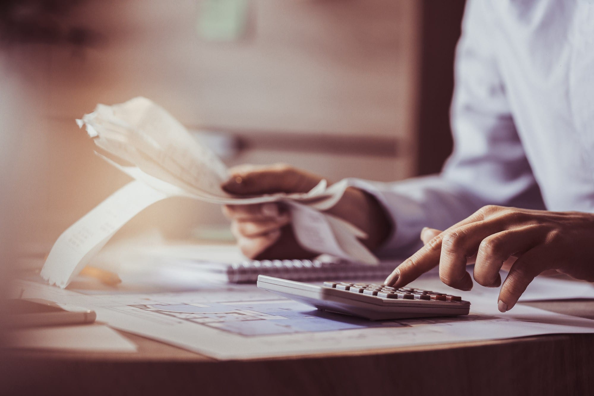 An accountant using a calculator