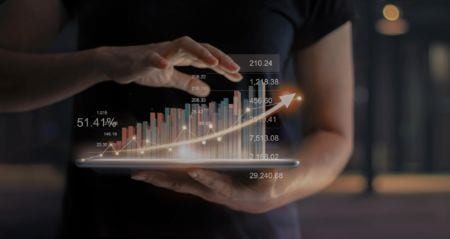Professional economist holding a tablet