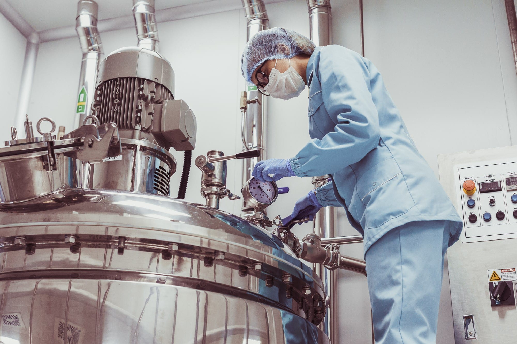 Science manufacturing technician checking equipment