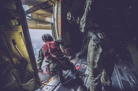 A worker checking a plane door