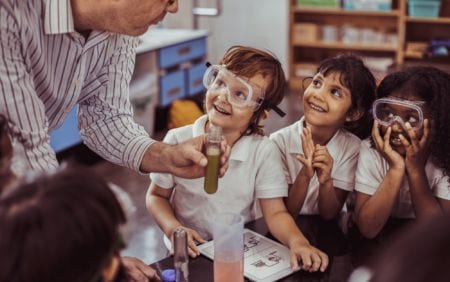 Kids learning chemistry in a classroom