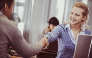 A man and woman shaking hands