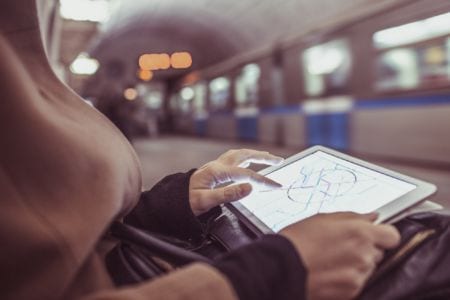 Transport planning technician using a map on a tablet