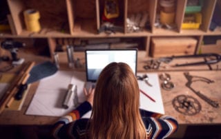 Management Apprenticeship - A woman working on a laptop