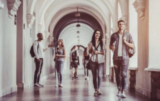 Students walking in a university hall