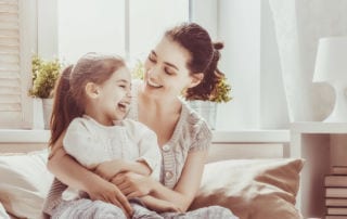 Career Paths - Young woman and a child smiling