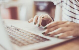 apprentice typing on a laptop looking for the right apprenticeship