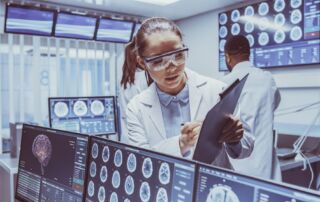 medical apprentice looking at scan