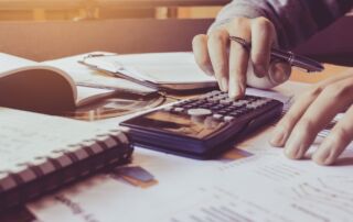 A person using a calculator